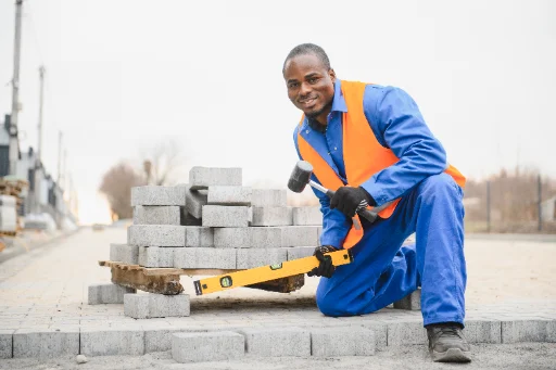 Construction worker holding tools